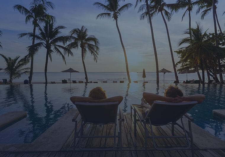 Relaxing by the pool at sunset