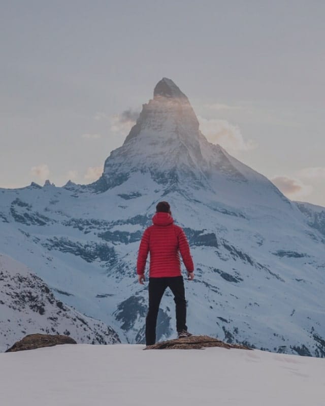 Lifestyle 26 Person gazing at snowy mountain peak