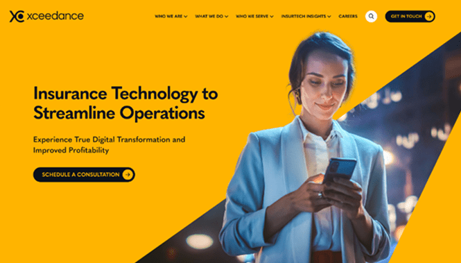 Xceedance website hero section with bold yellow background and a professional using a smartphone, highlighting insurance technology solutions.