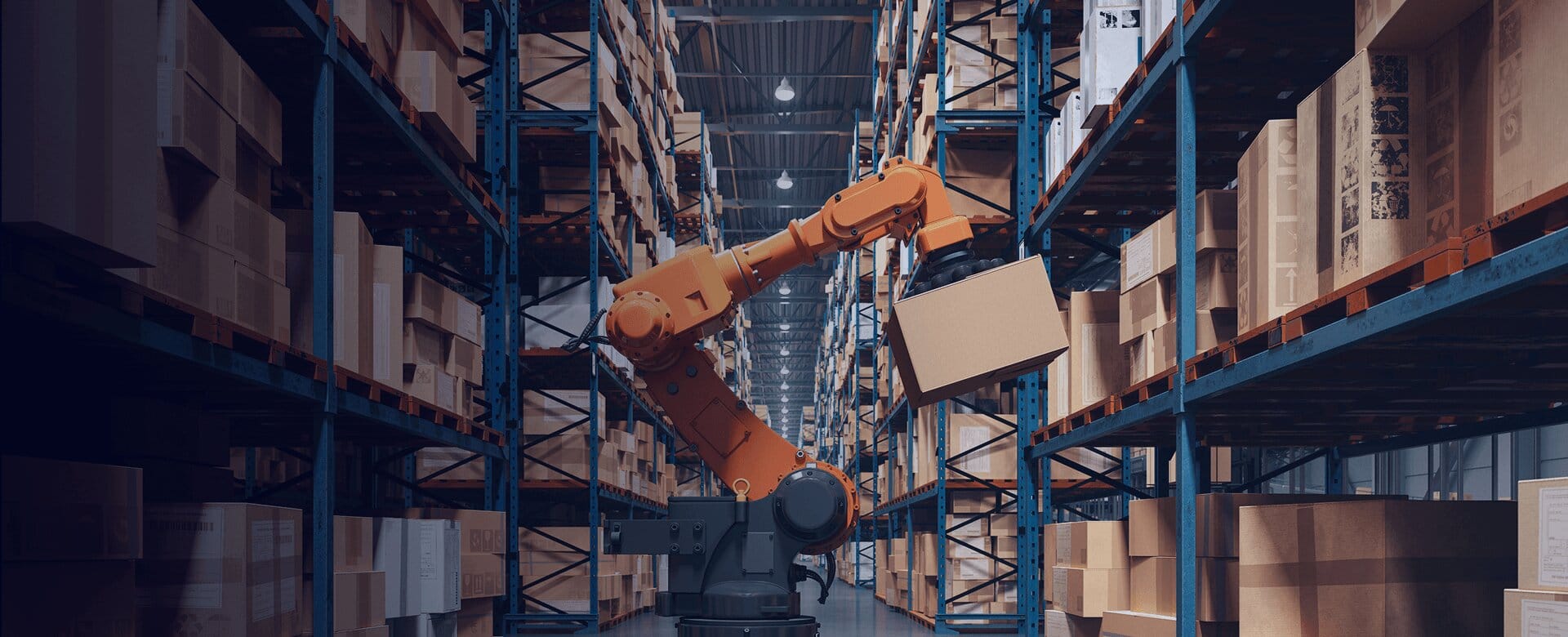 A robotic arm lifts a cardboard box in a large warehouse aisle lined with storage racks
